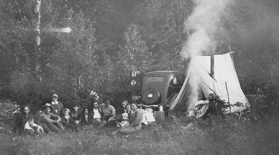 Sister Irene Faye with families at campsite
